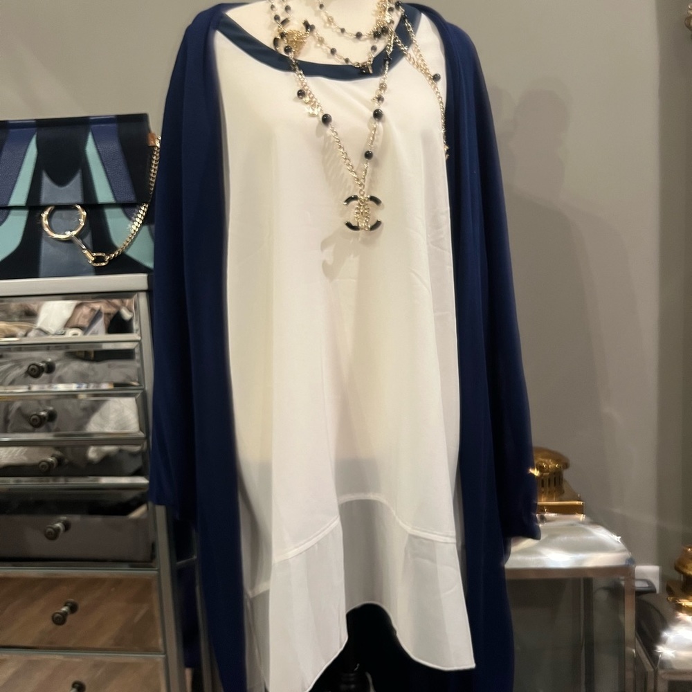 Melissa McCarthy seven sweater is a bright blue that can be worn several ways